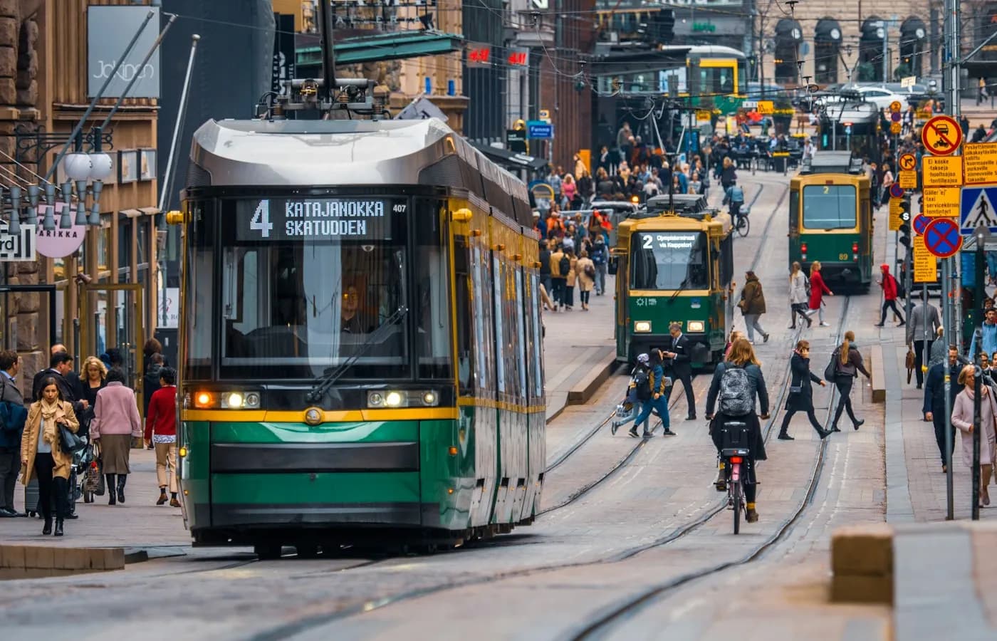 Tram in service on a busy city street